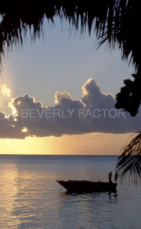 Sunset Island;fiji;colorful;yellow;sunset;sky;water;boat;pink;sillouettes;trees